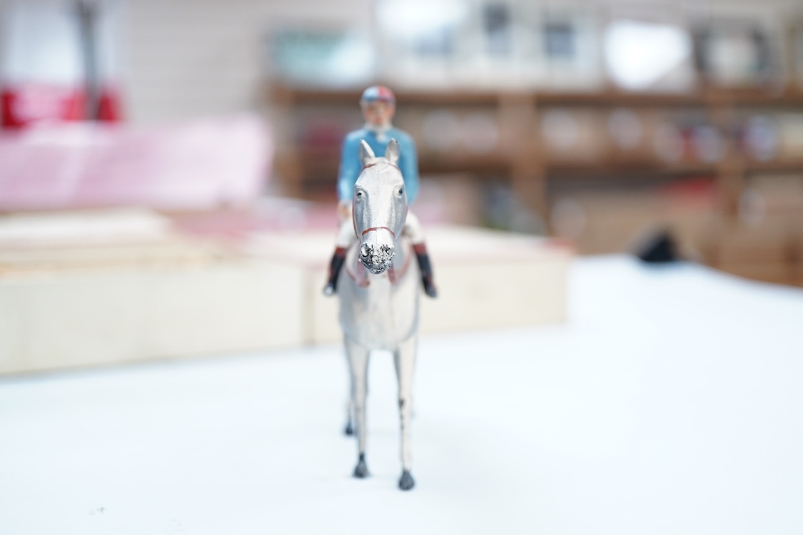 Two boxed Britains Racing Colours of Famous Owners series lead mounted figures; Lord Astor - rider in blue jersey with a pink sash on a grey horse (one leg broken and missing), and. the Duke of Norfolk - rider in blue je